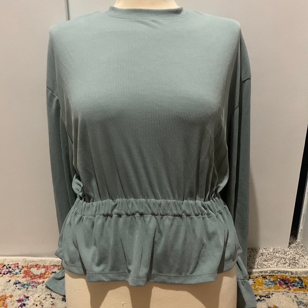 Size XS long sleeve cinched shirt. Light blue. Brand is A new day